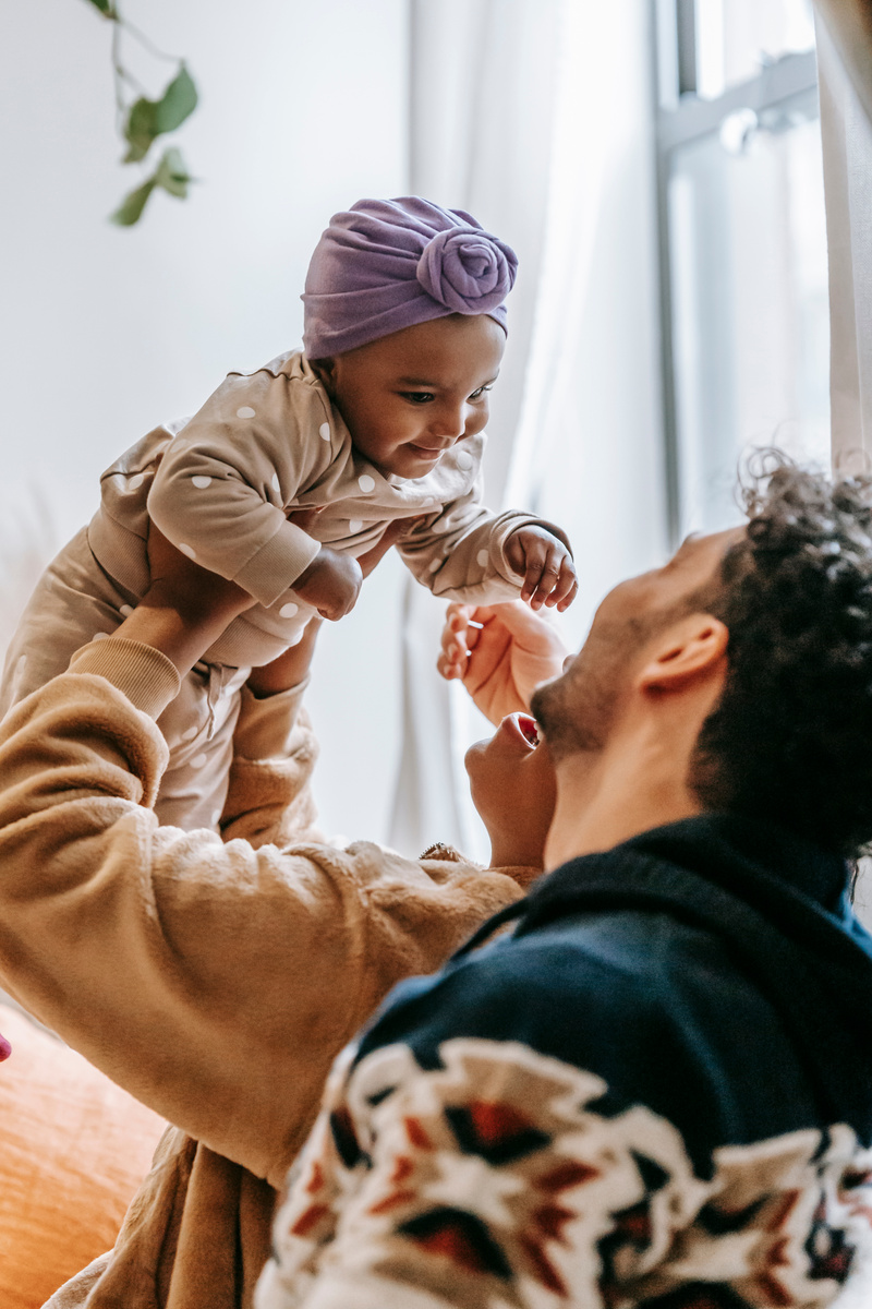 Unrecognizable multiracial family with black baby
